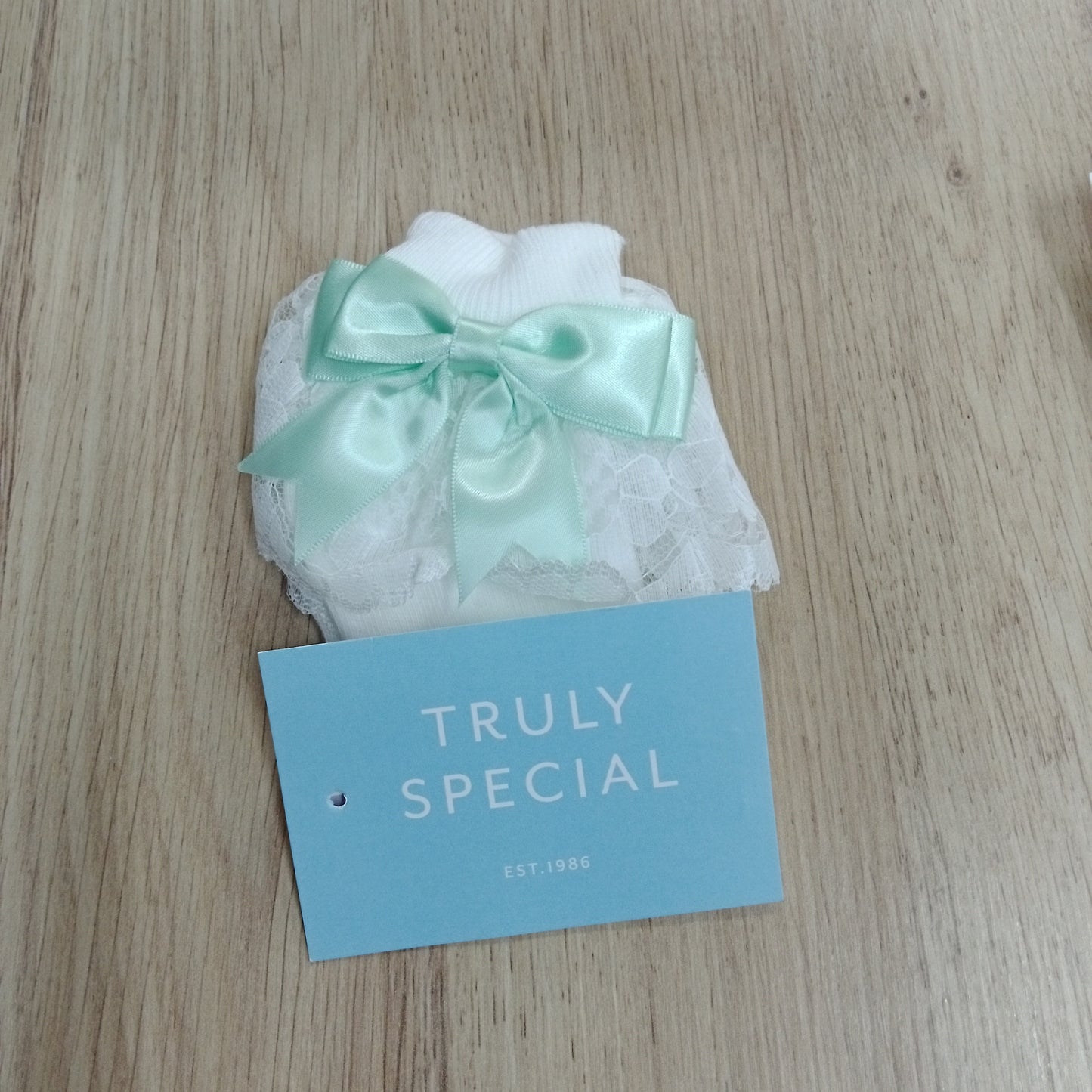 Sara Jayne White Lace Sock with Green Bow