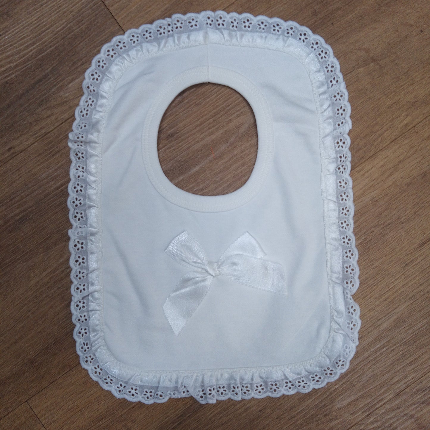 White Trim Pull Over Bib with Bow