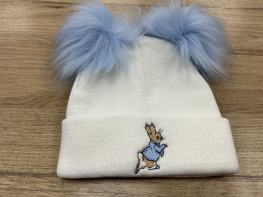 Large blue embroidered Peter rabbit white hat with pink faux Pom poms and turnover