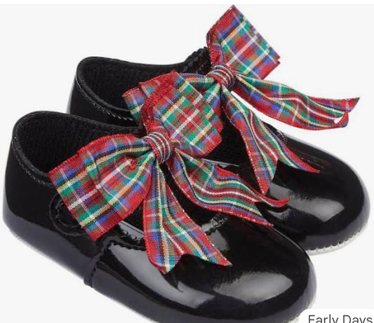 Black patent soft sole shoe with large tartan bow