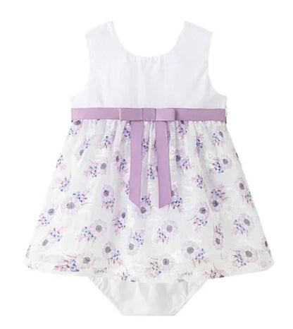 Lilac and white dress with printed and embroidered organza over skirt with pants.