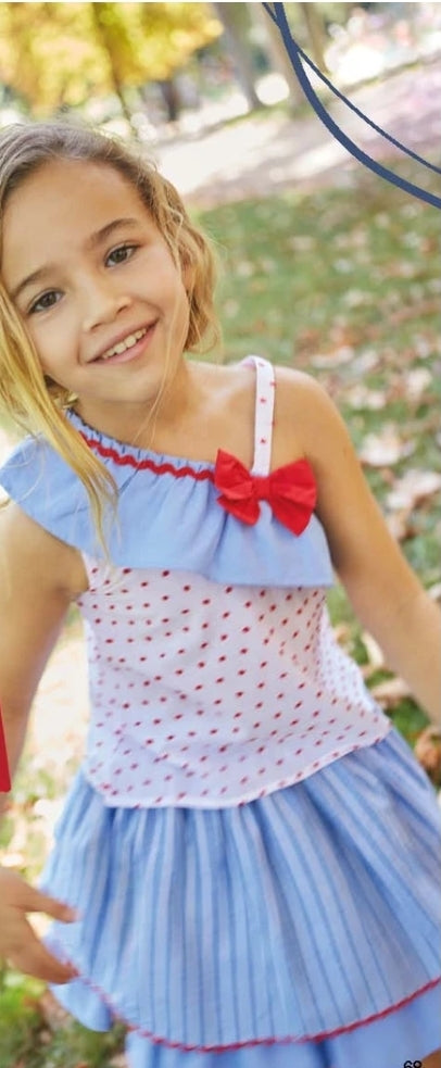 Girls  blue summer skirt and blouse set with red polka dot detail.