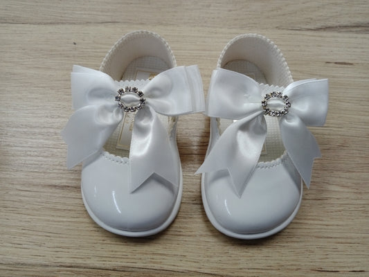 Hard sole white diamante bow shoe